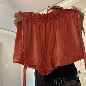 Rose gold flowy shorts that tie